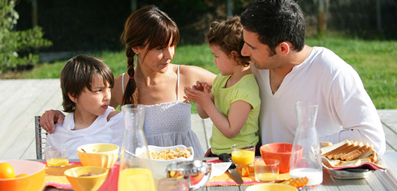family eating healthy breakfast family eating healthy breakfast