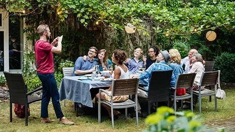 friends enjoying lunch in the garden