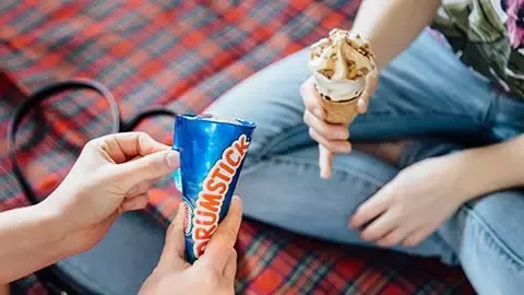 People eating Drumstick